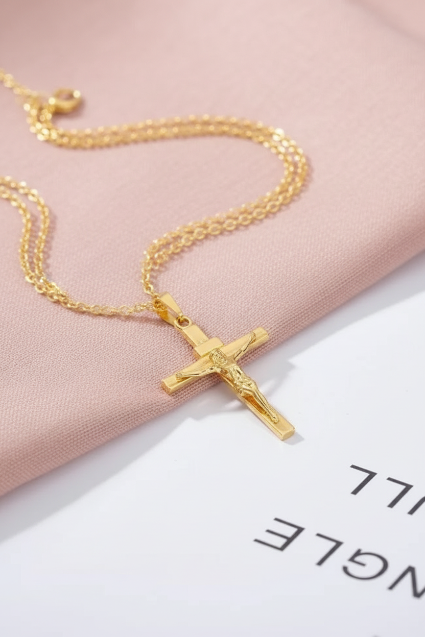 Gold crucifix flat lay - overhead angle